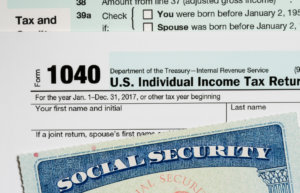 United state tax return with social security card on top.