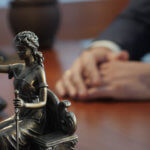 Lady of Justice on attorney desk